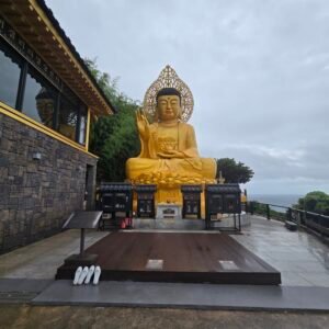 majestic golden buddha statue at the sanbangsan shrine on jeju island